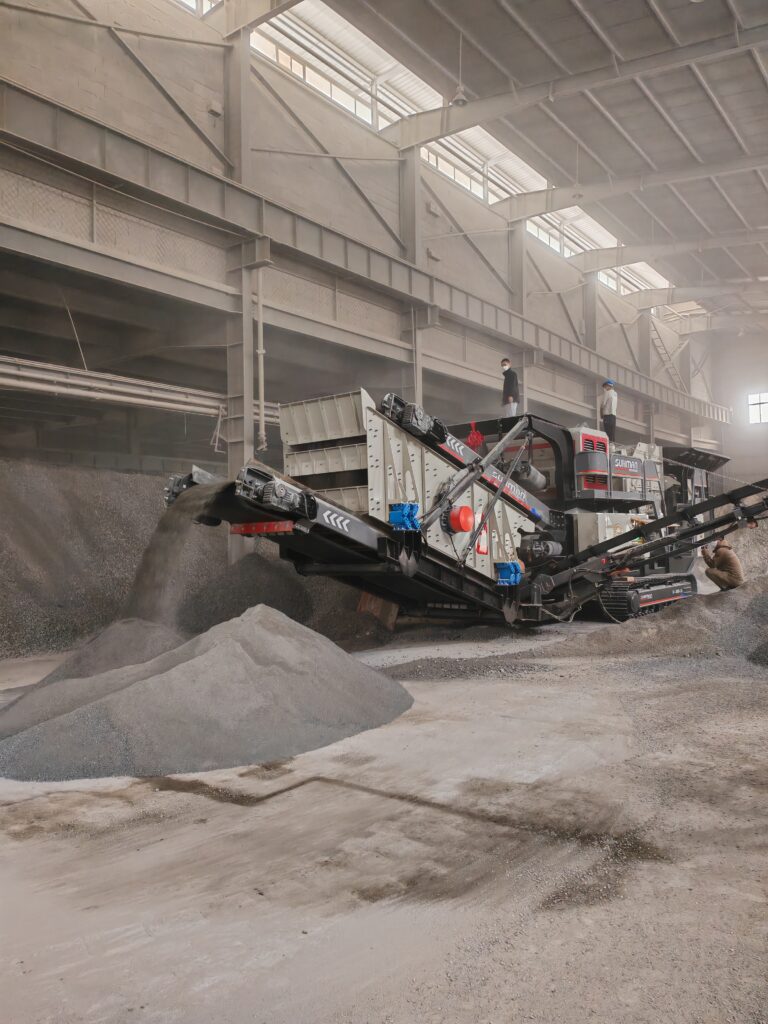 What is the purpose of the hanging screen on the crusher